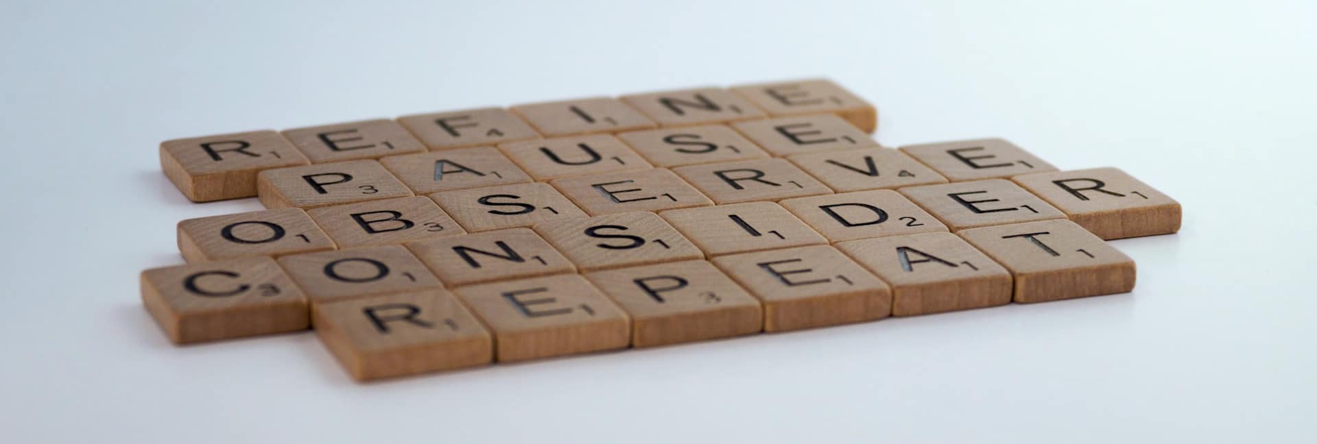 Wooden letters: refine, pause, observe, consider, repeat