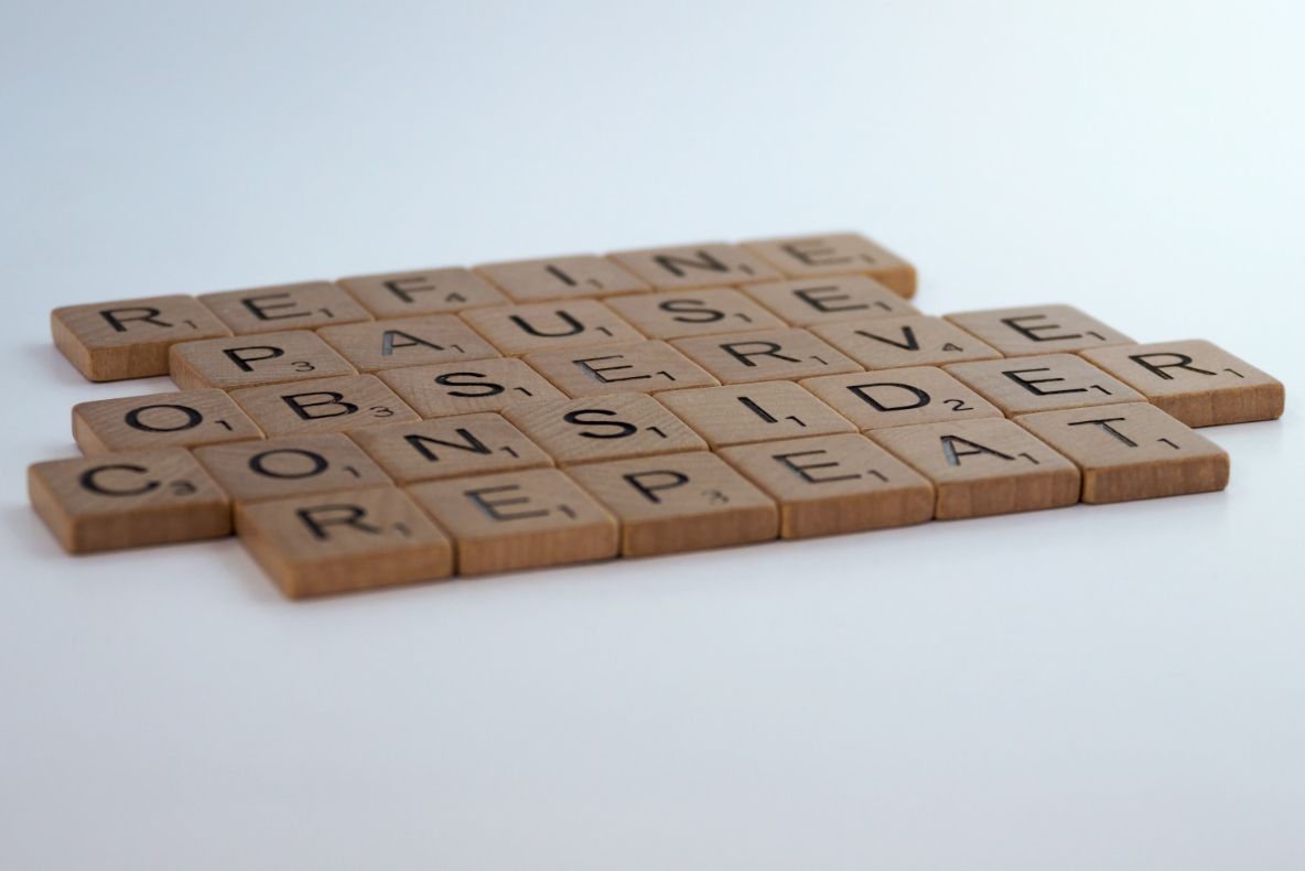 Wooden letters: refine, pause, observe, consider, repeat